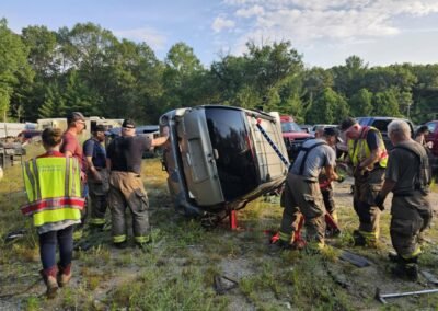 Members stabilize a vehicle on its side