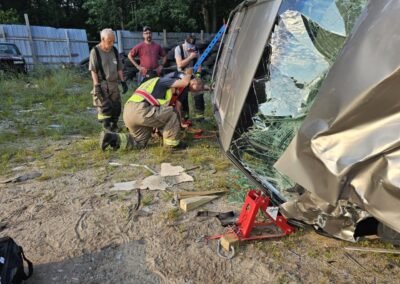 Members cut into a vehicle during extrication training