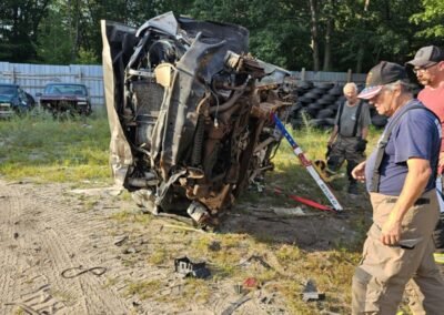 Members work on an overturned vehicle