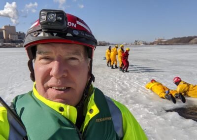 Fred R. LaPoint on the ice during the training, with the drill behind him