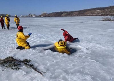Rescuers move toward a person in the water while members watch