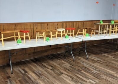 Handmade chairs and furniture set out for the silent auction