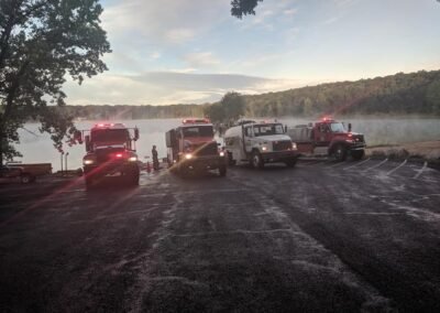 Fire tankers lined up at the Sand Lake boat launch at sunrise