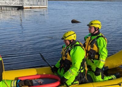 Members paddle the rescue craft