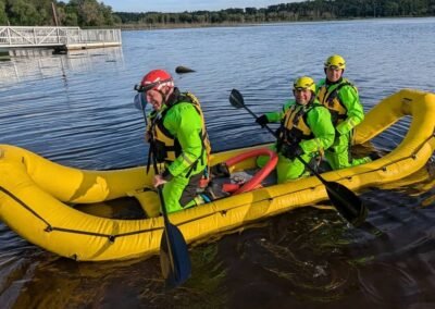 The crew paddles the rescue craft near the dock